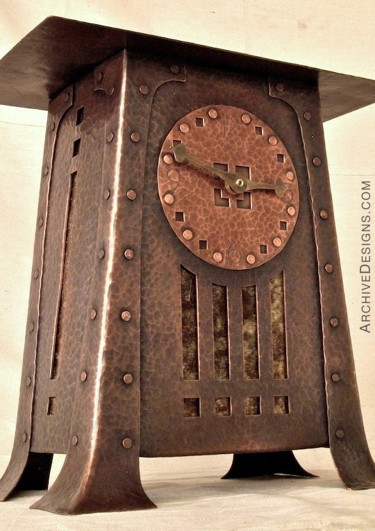 Clock in hammered copper with copper rivets.